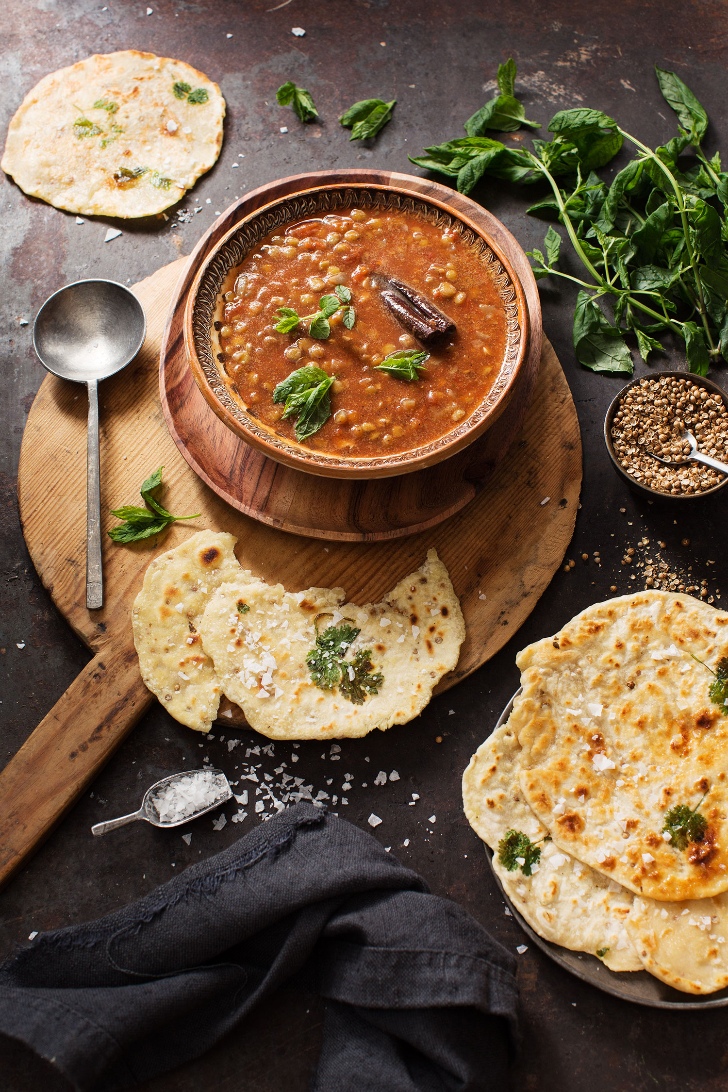 a bowl of soup and some flatbreads