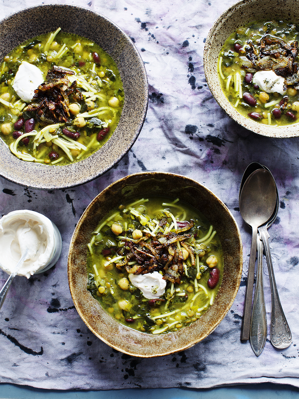 bowls of soup with beans and noodles