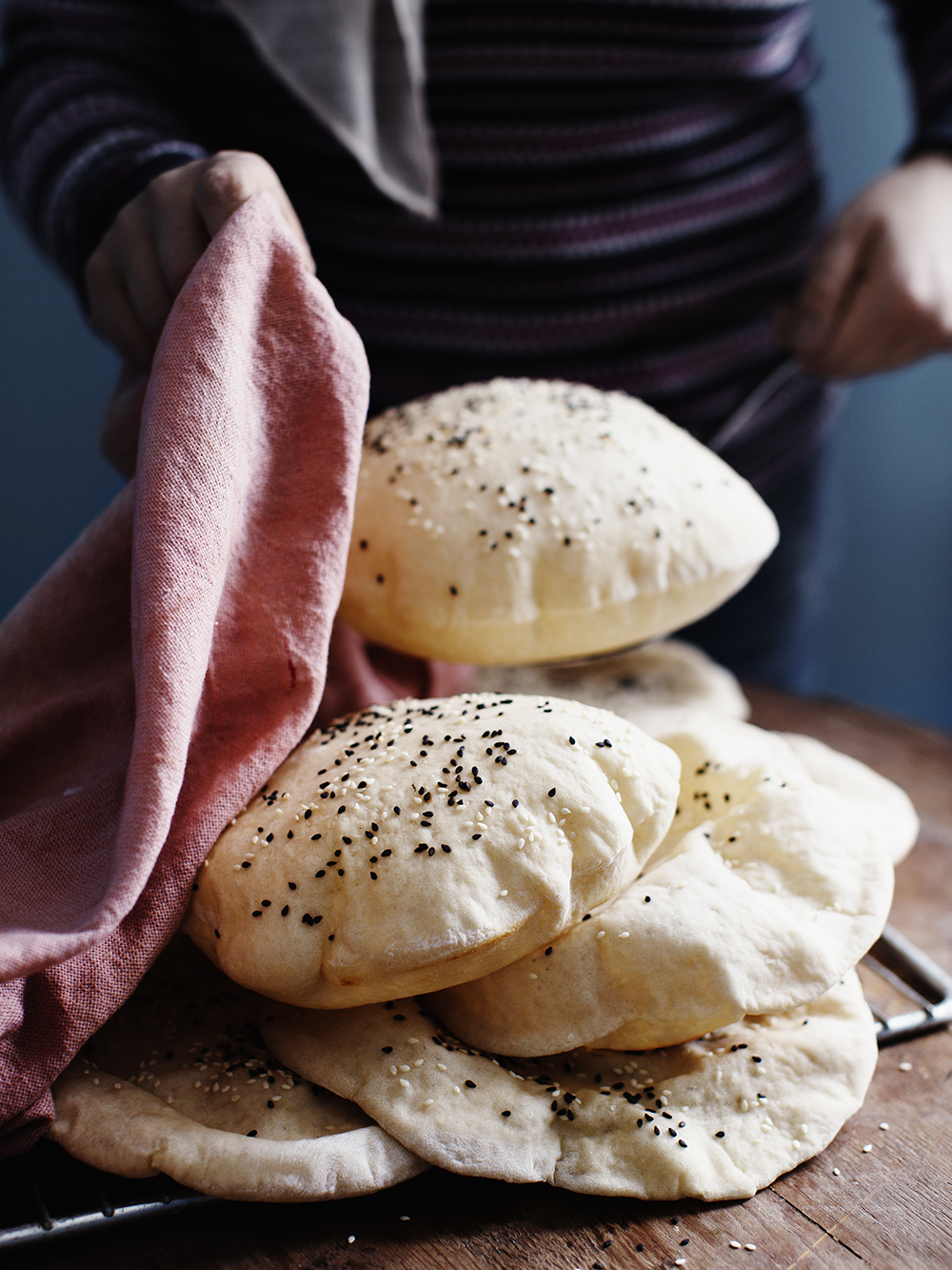 a stack of bread with a pink towel