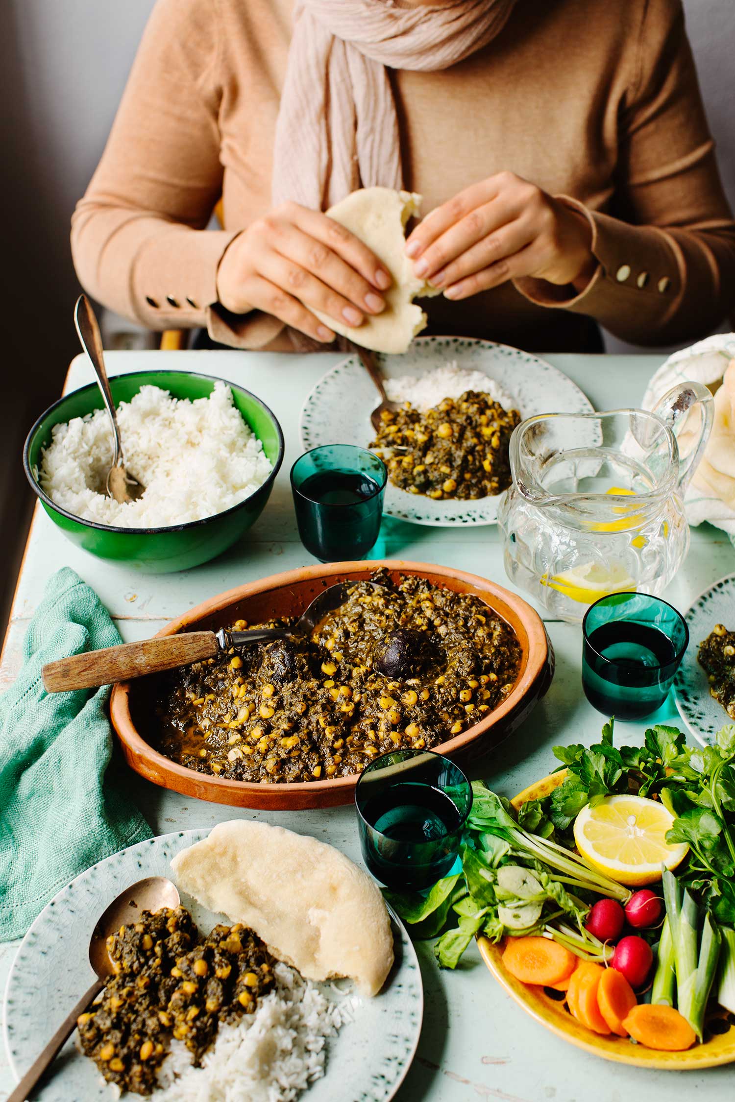 a person eating food on a table