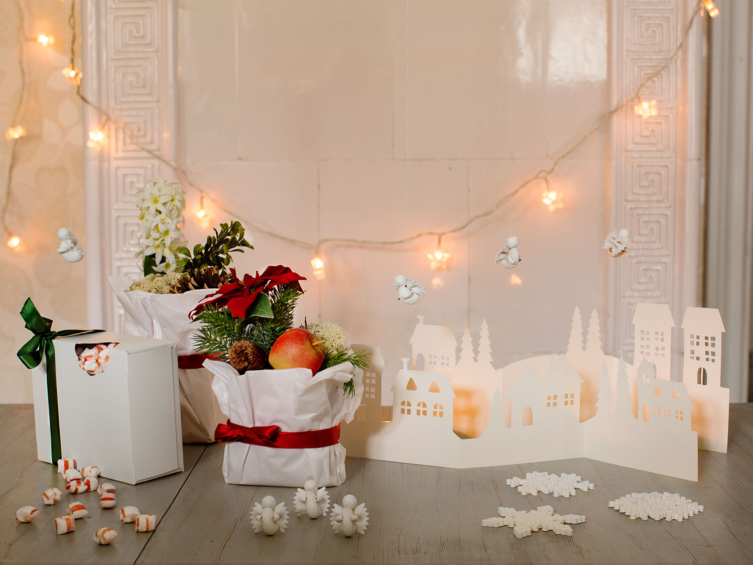 a group of boxes with flowers and a paper cut out of it