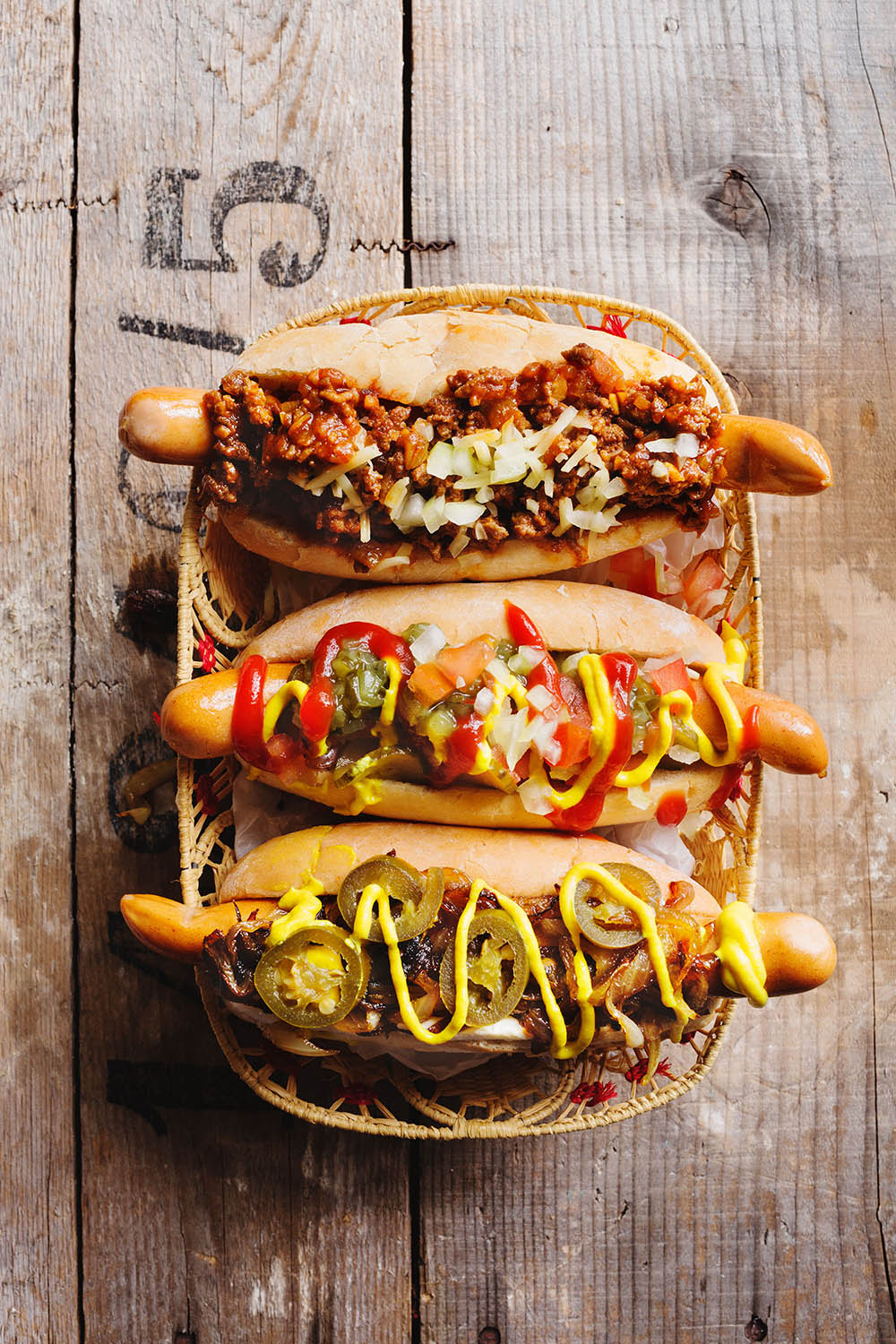 a group of hot dogs in a basket