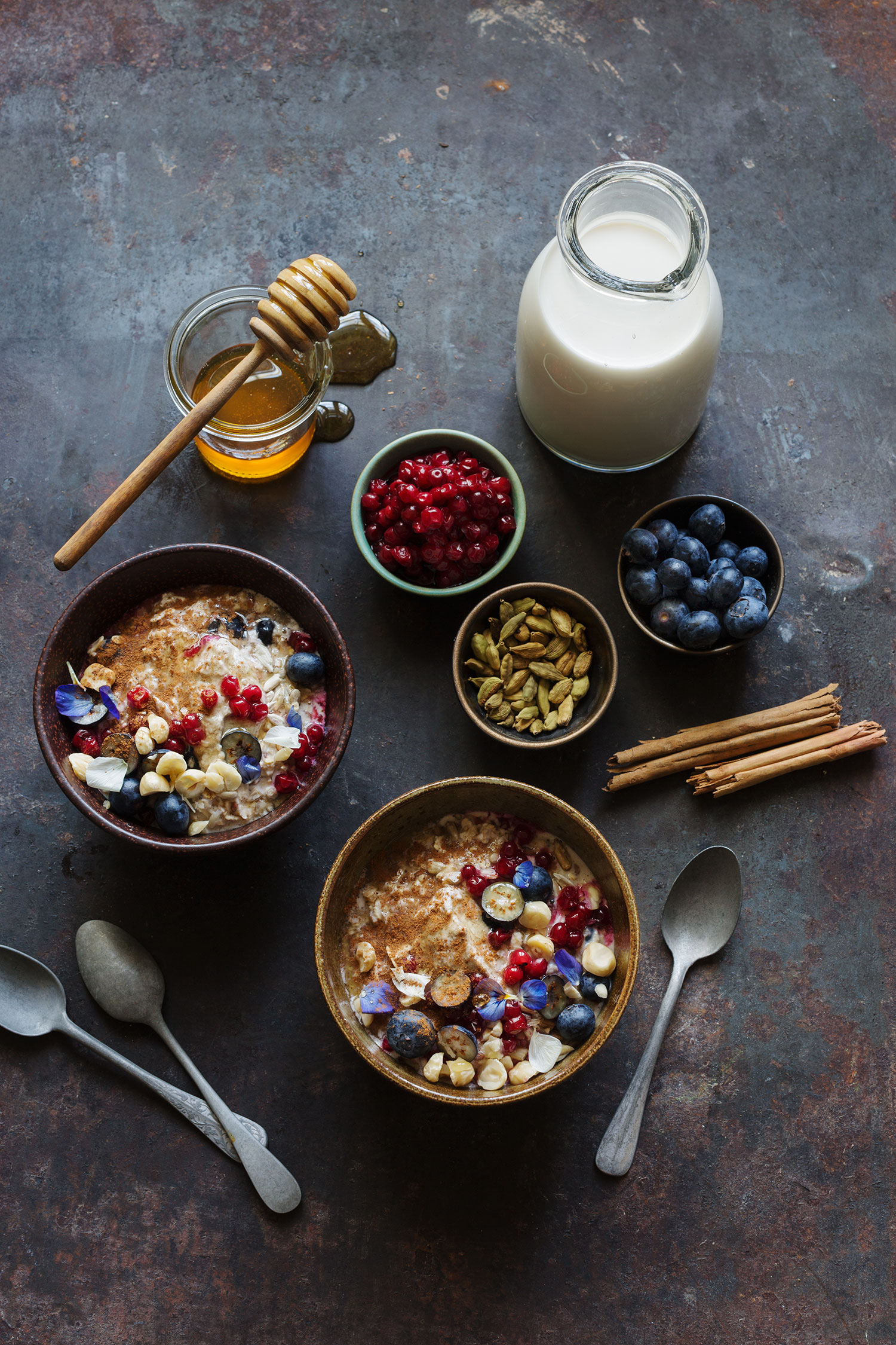 bowls of food with spoons and milk