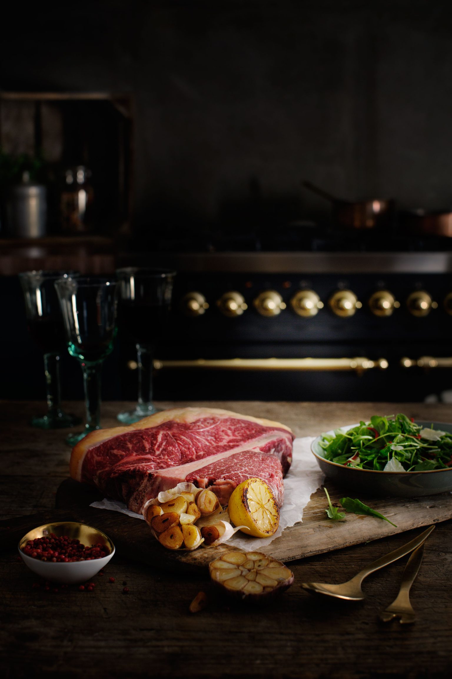 a steak and salad on a cutting board