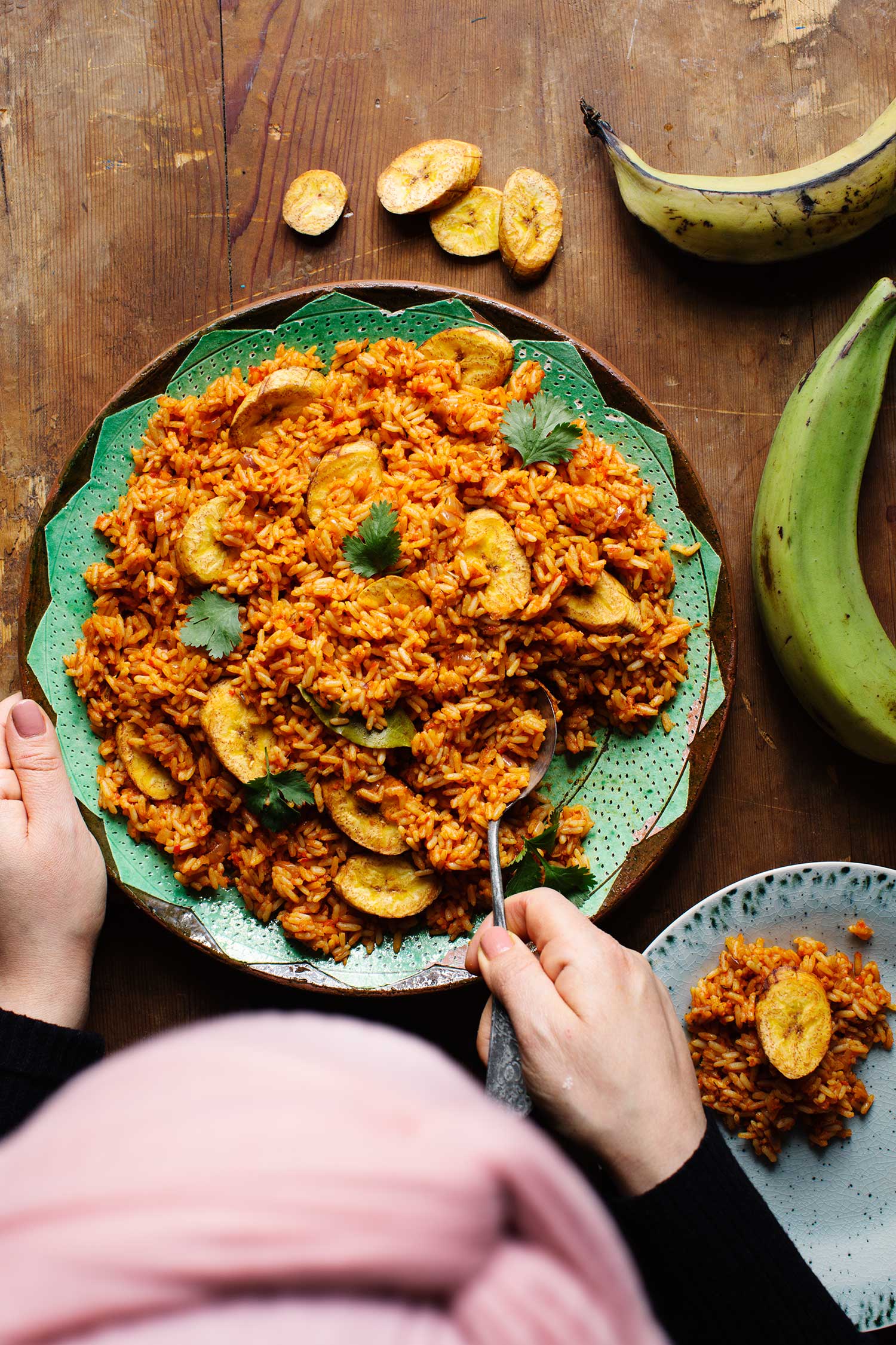 a person eating a plate of rice
