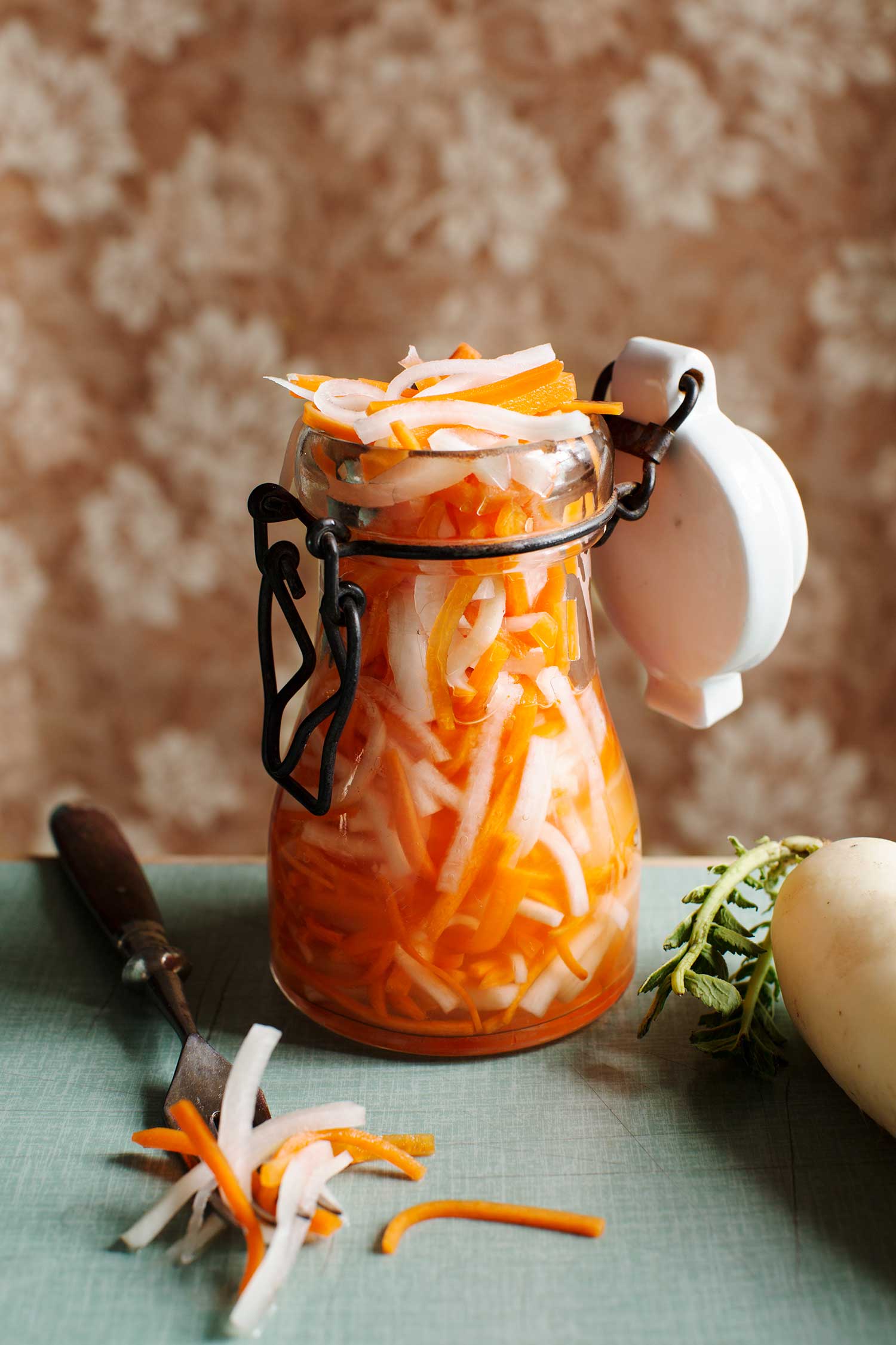 a jar of carrots and onions