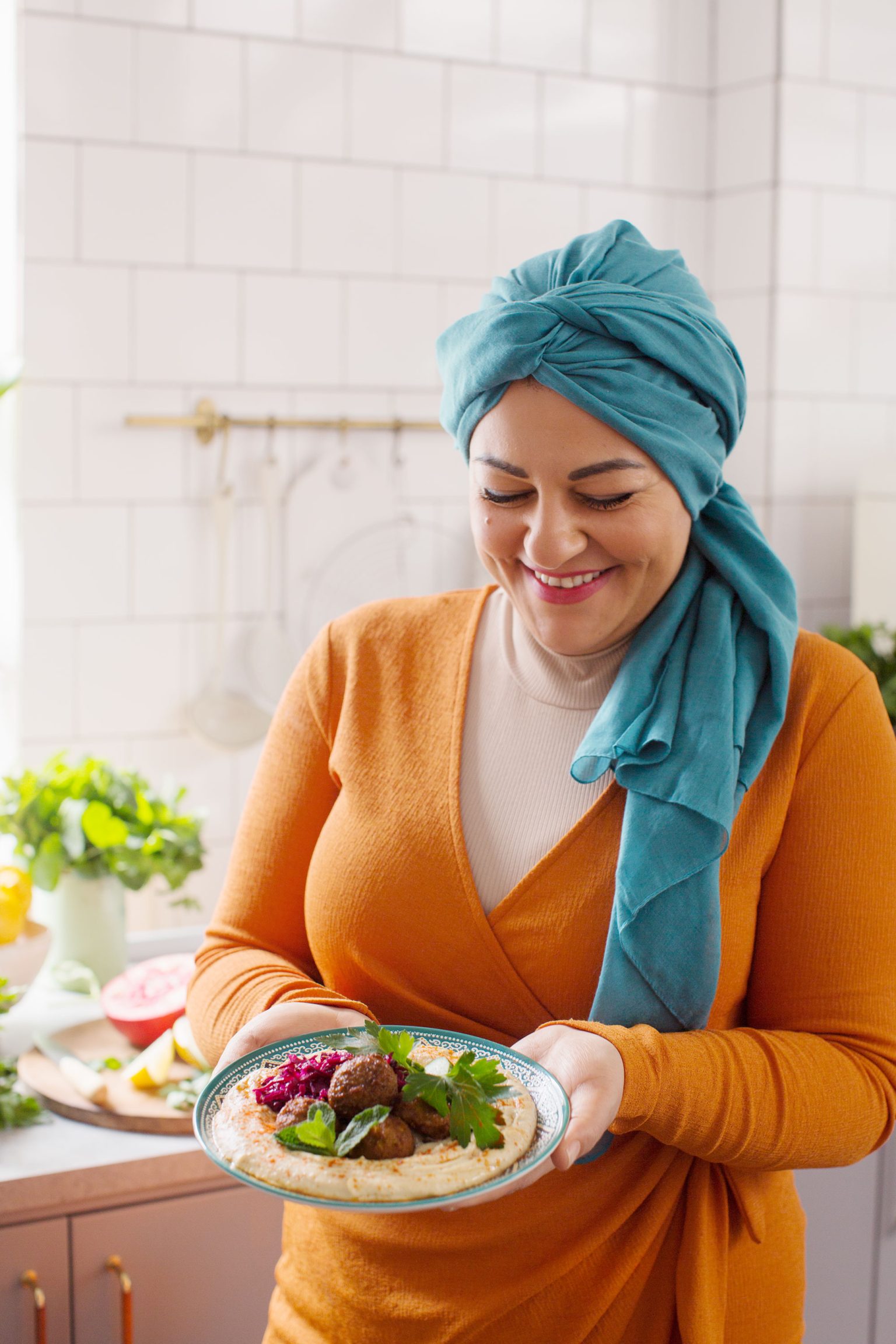 a woman holding a bowl of food