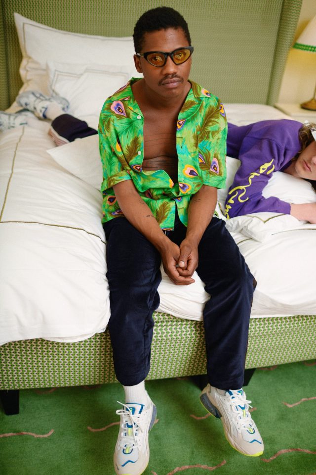 a man sitting on a bed