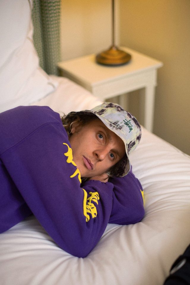 a man lying on a bed