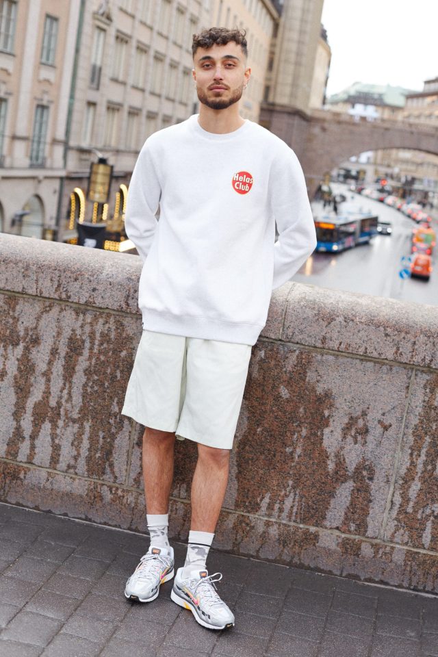 a man standing on a stone wall