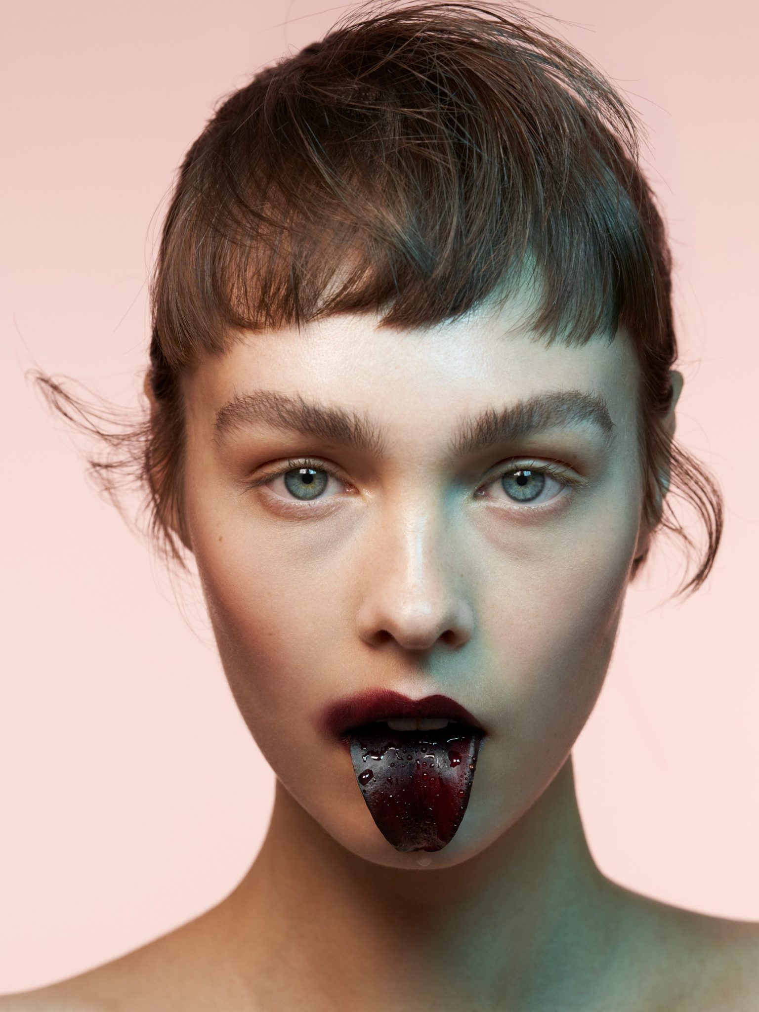 a woman with a black tongue