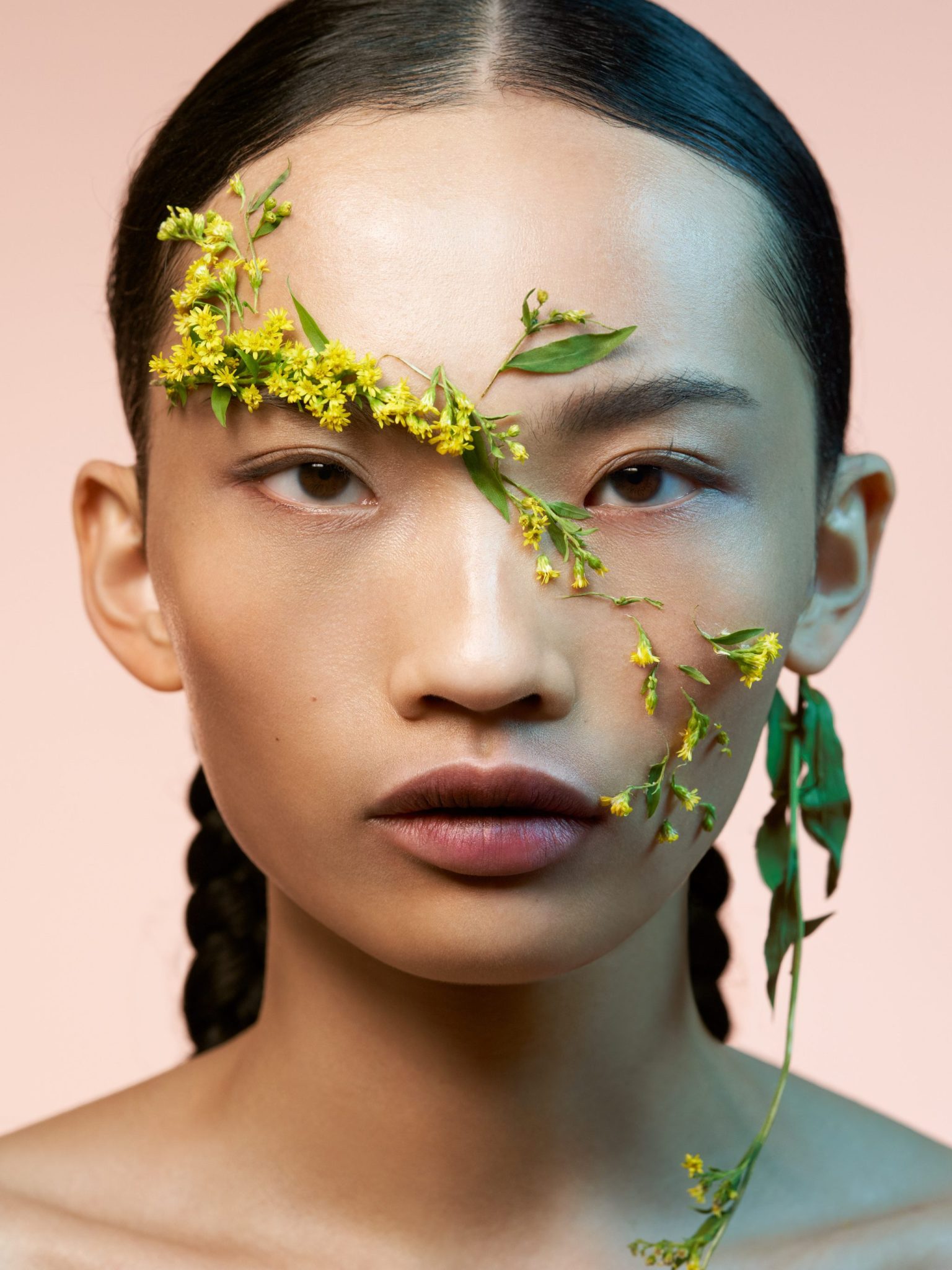 a woman with flowers on her face
