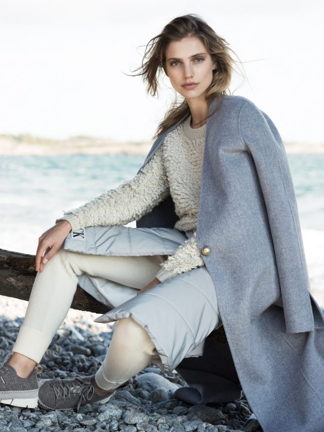 a woman sitting on a log