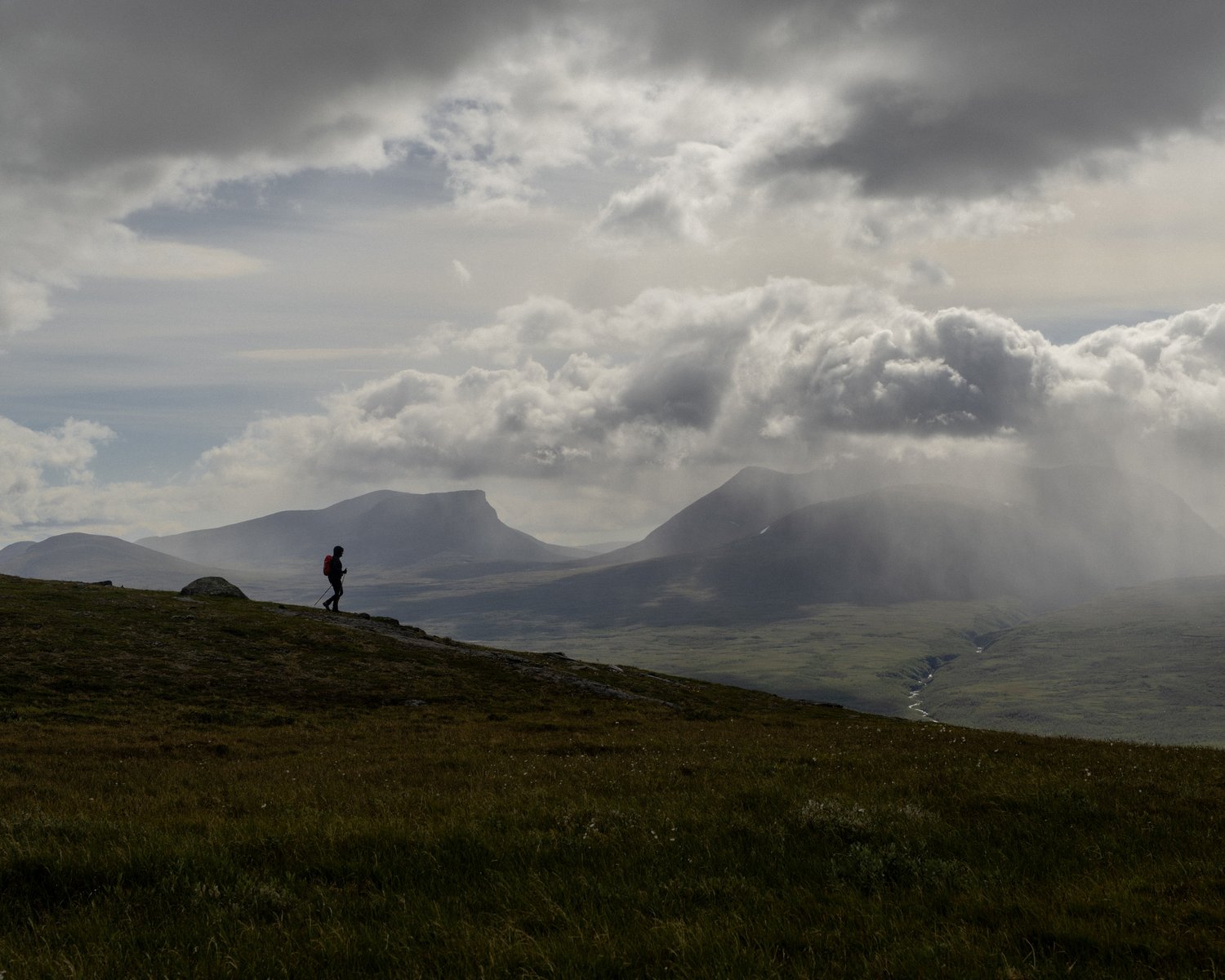 a person walking on a hill