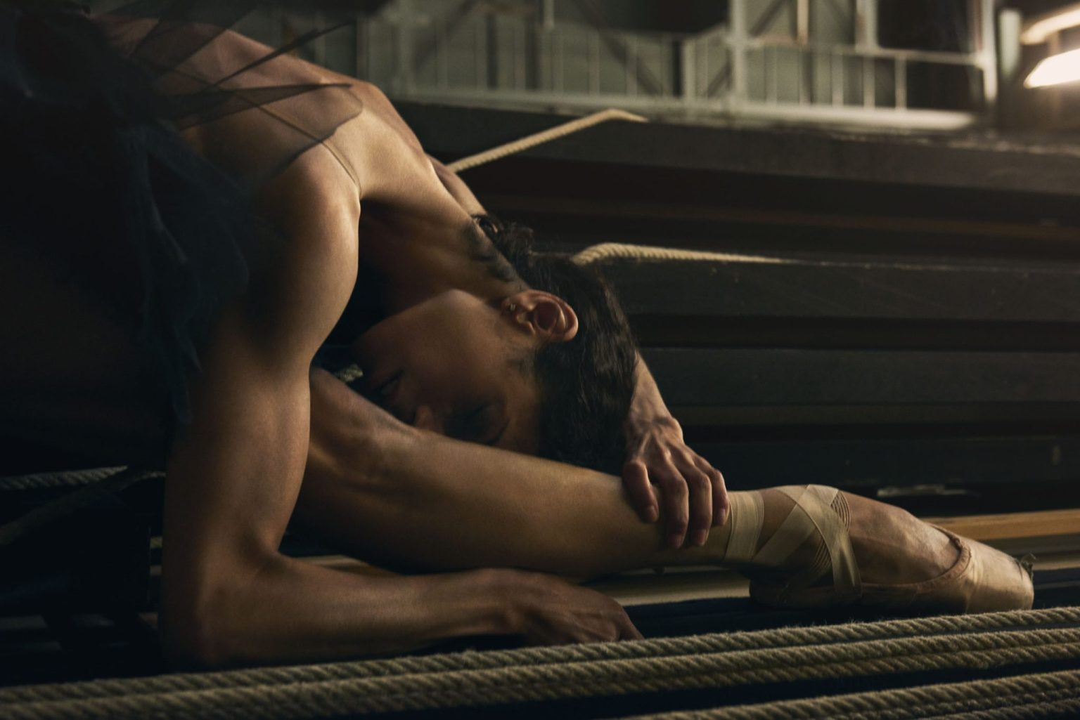 a ballerina lying on the floor