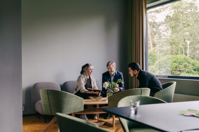 a group of people sitting around a table