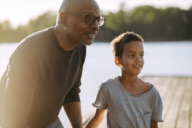 a man and boy looking at each other