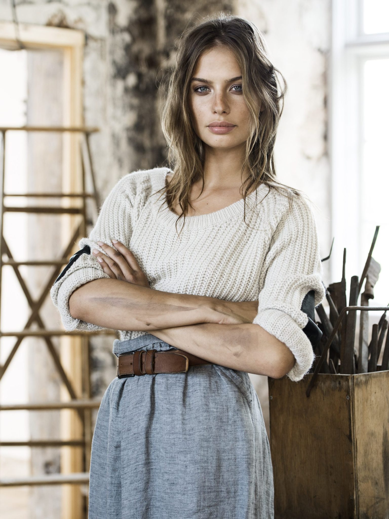 a woman with her arms crossed