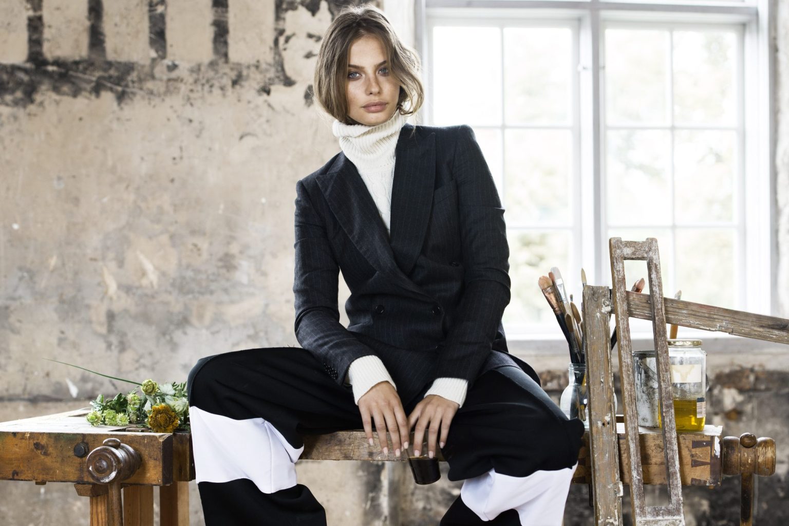 a woman sitting on a table