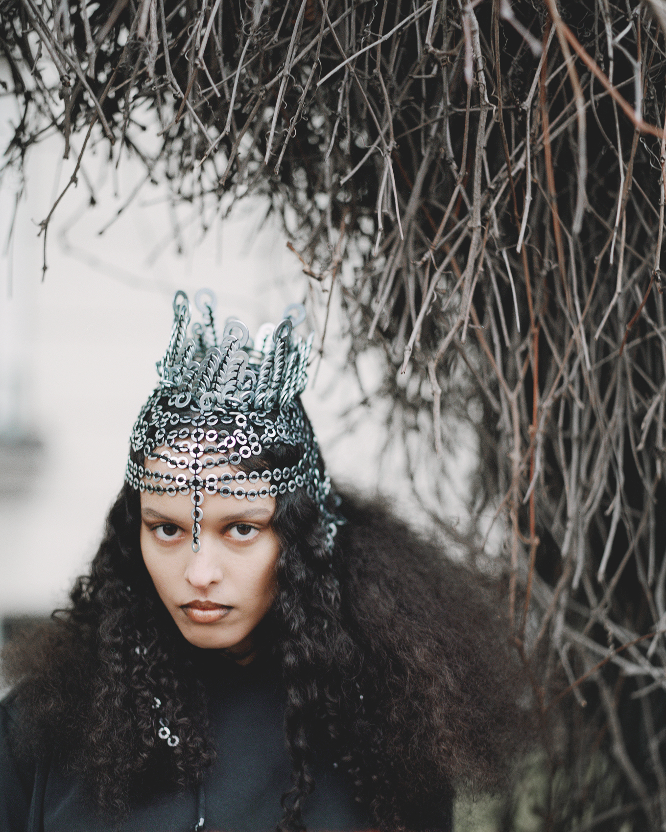 a woman with a crown and hair piece