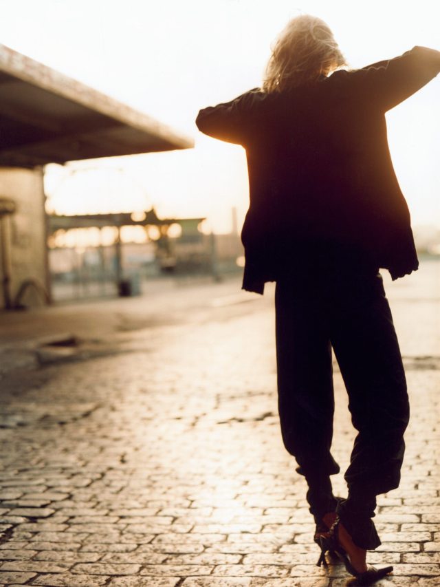 a person standing on a brick road