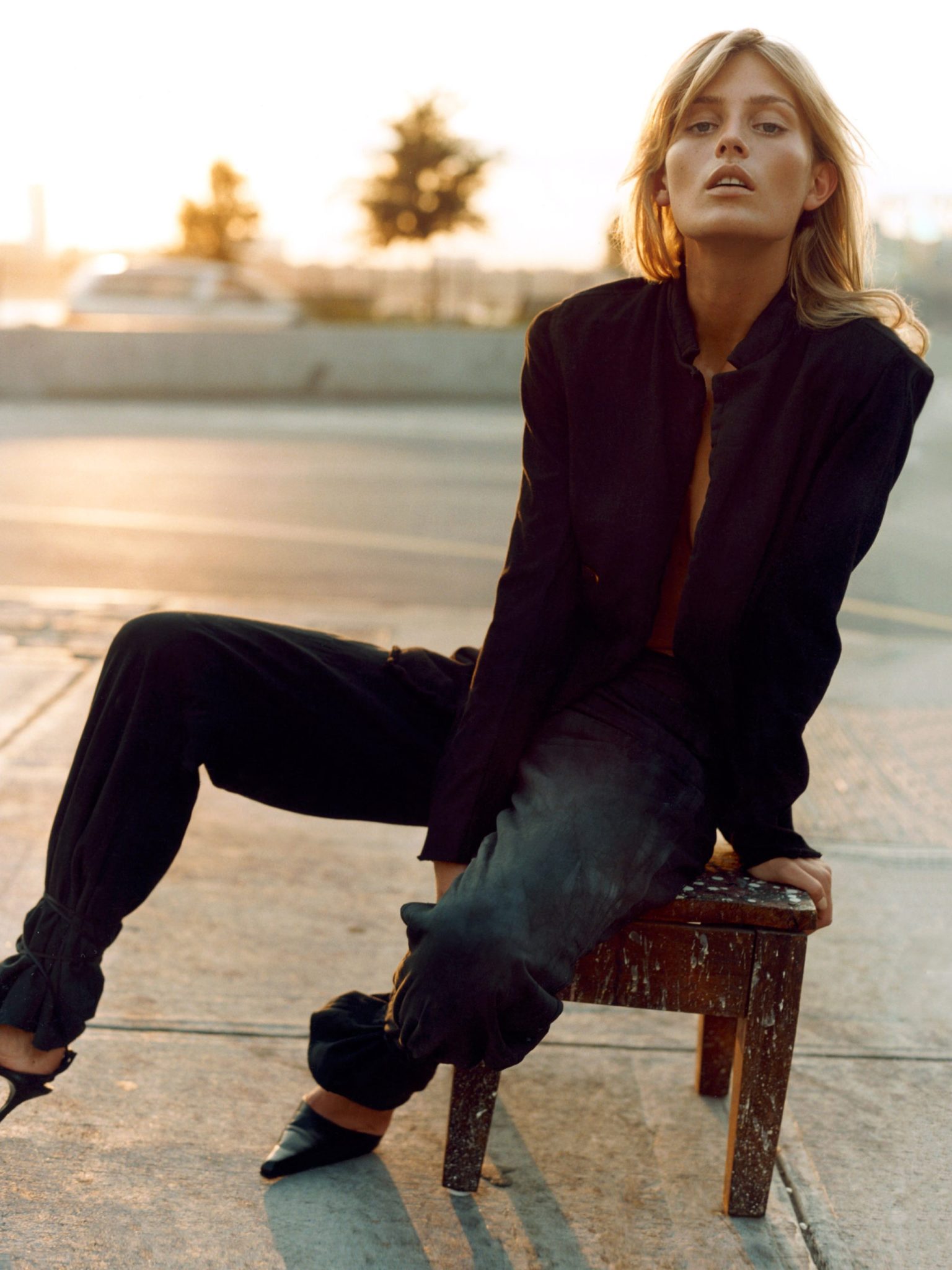 a woman sitting on a bench