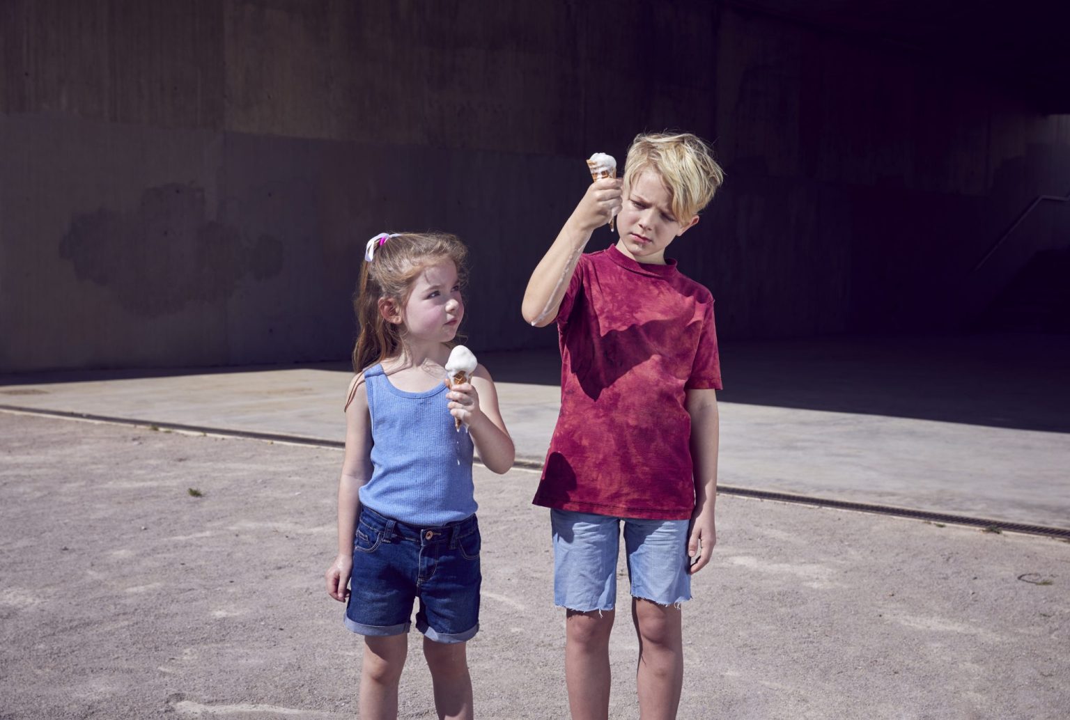 a boy and girl eating ice cream