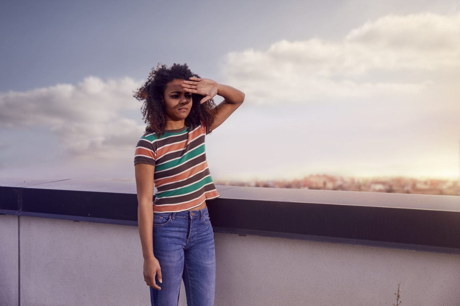 a woman standing on a roof