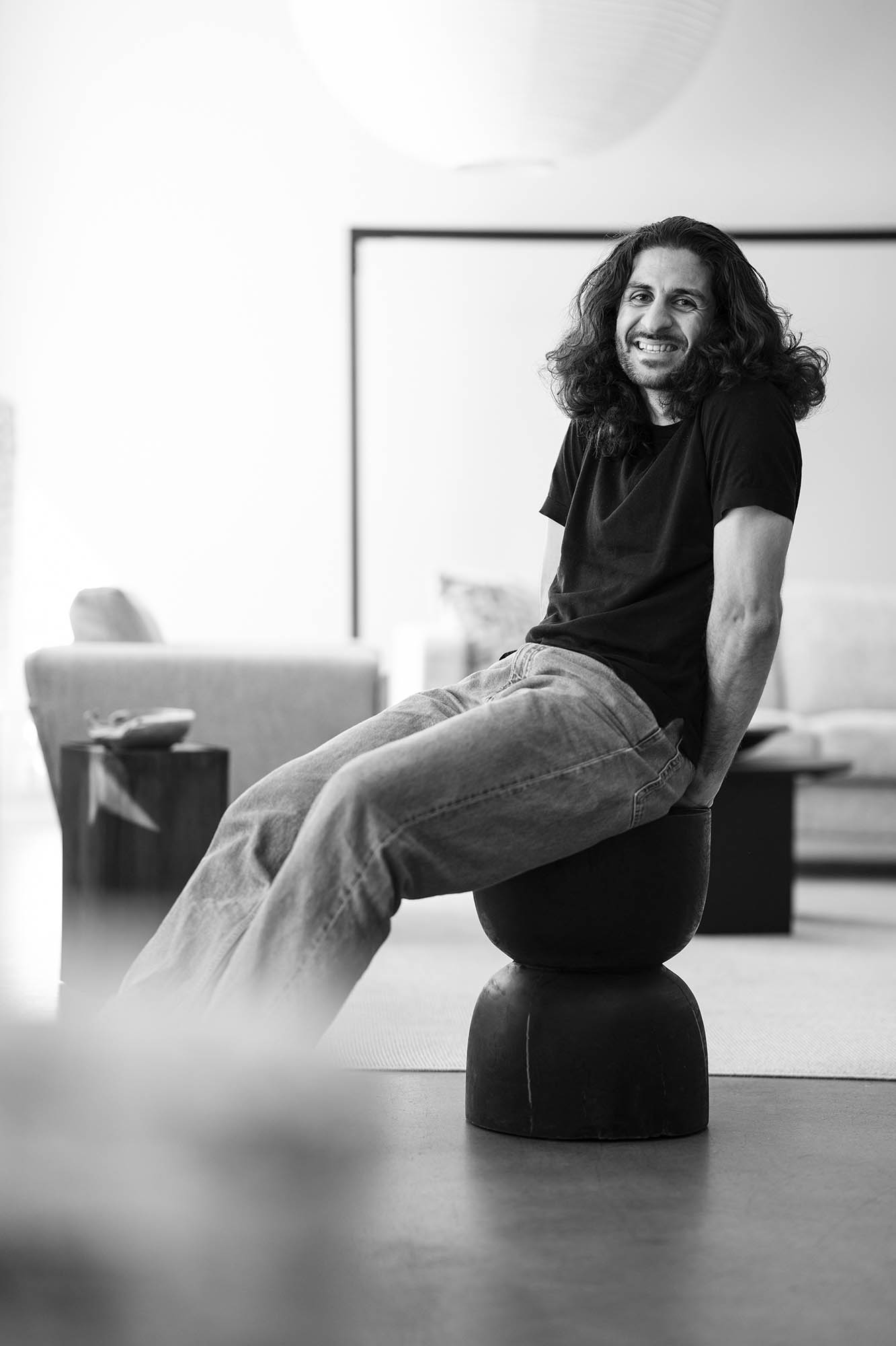 a man sitting on a black object