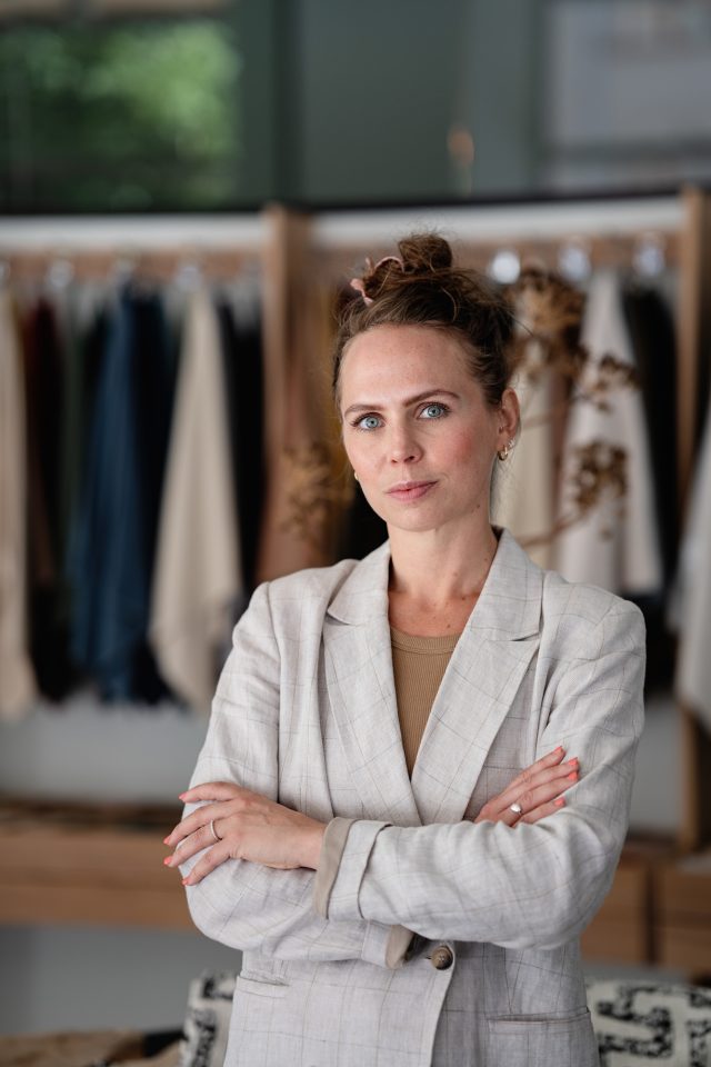 a woman in a white suit