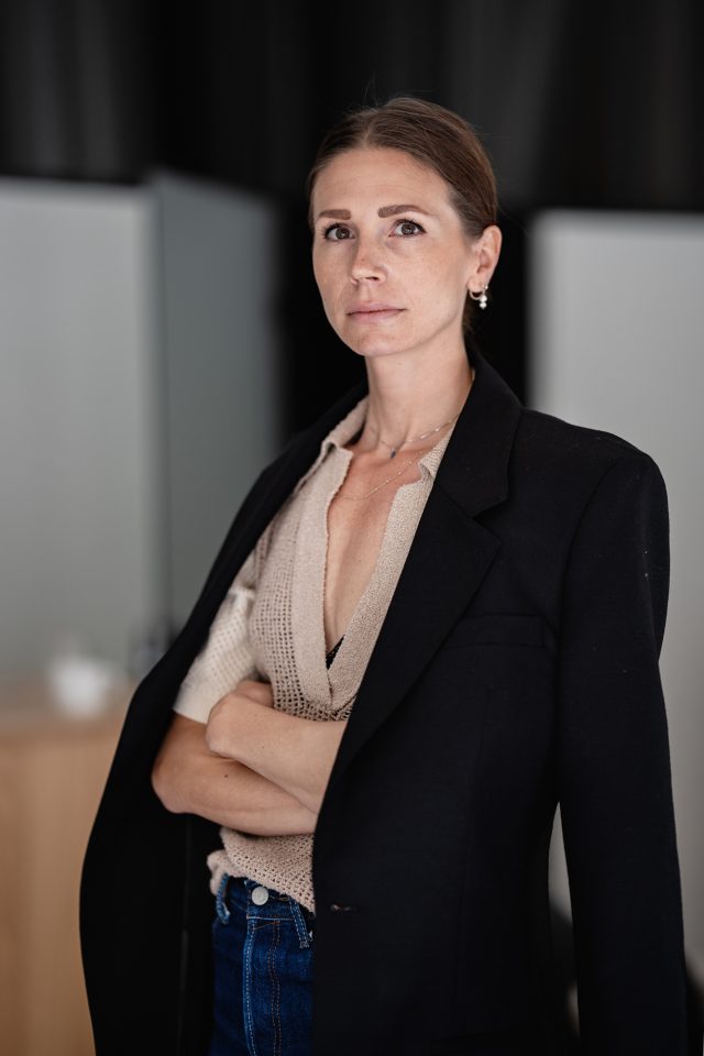 a woman in a black jacket