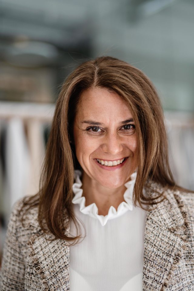 a woman smiling at camera