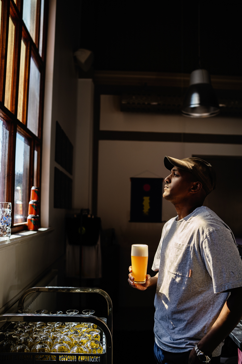 a man holding a glass of beer