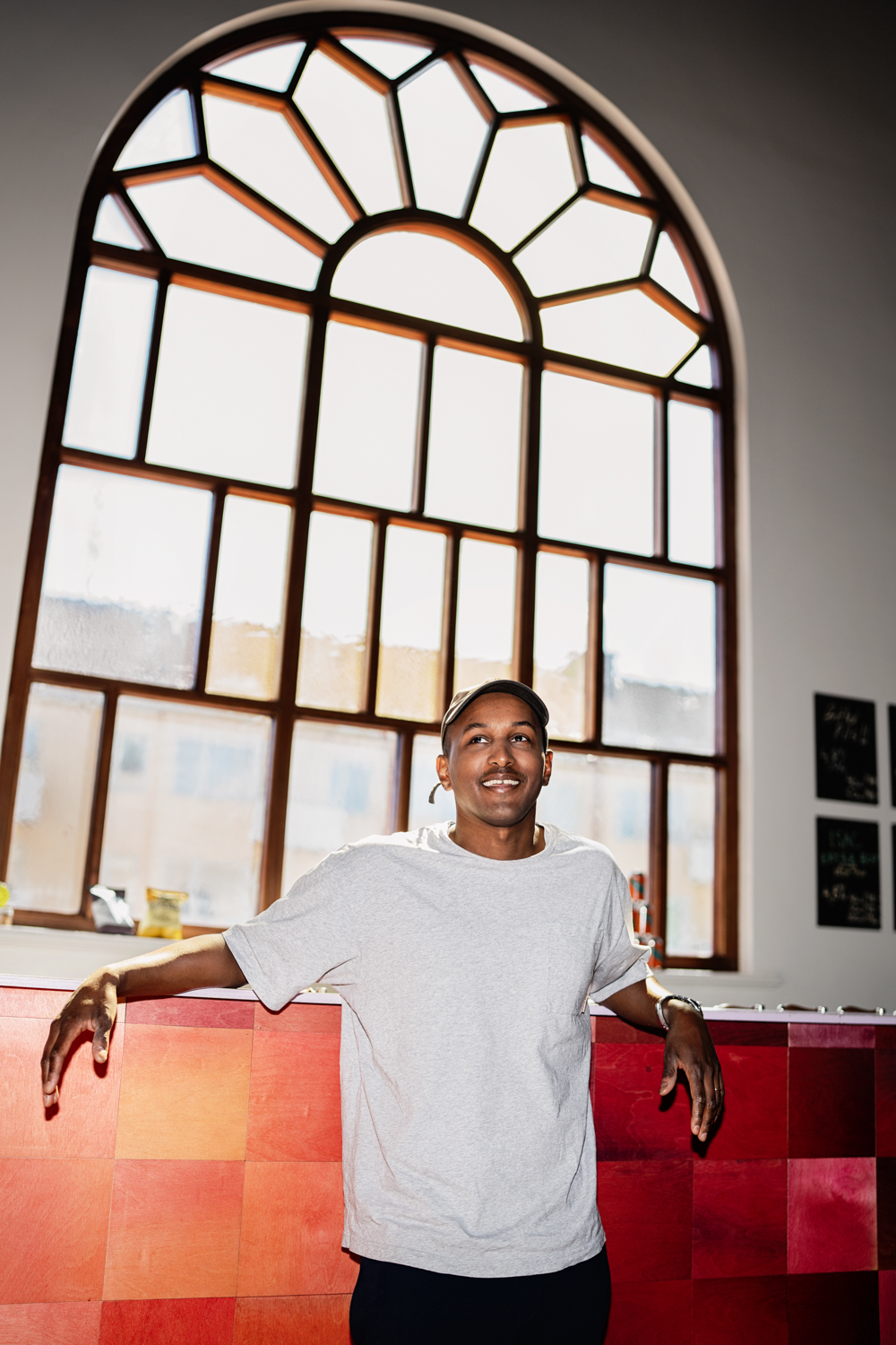 a man leaning against a counter