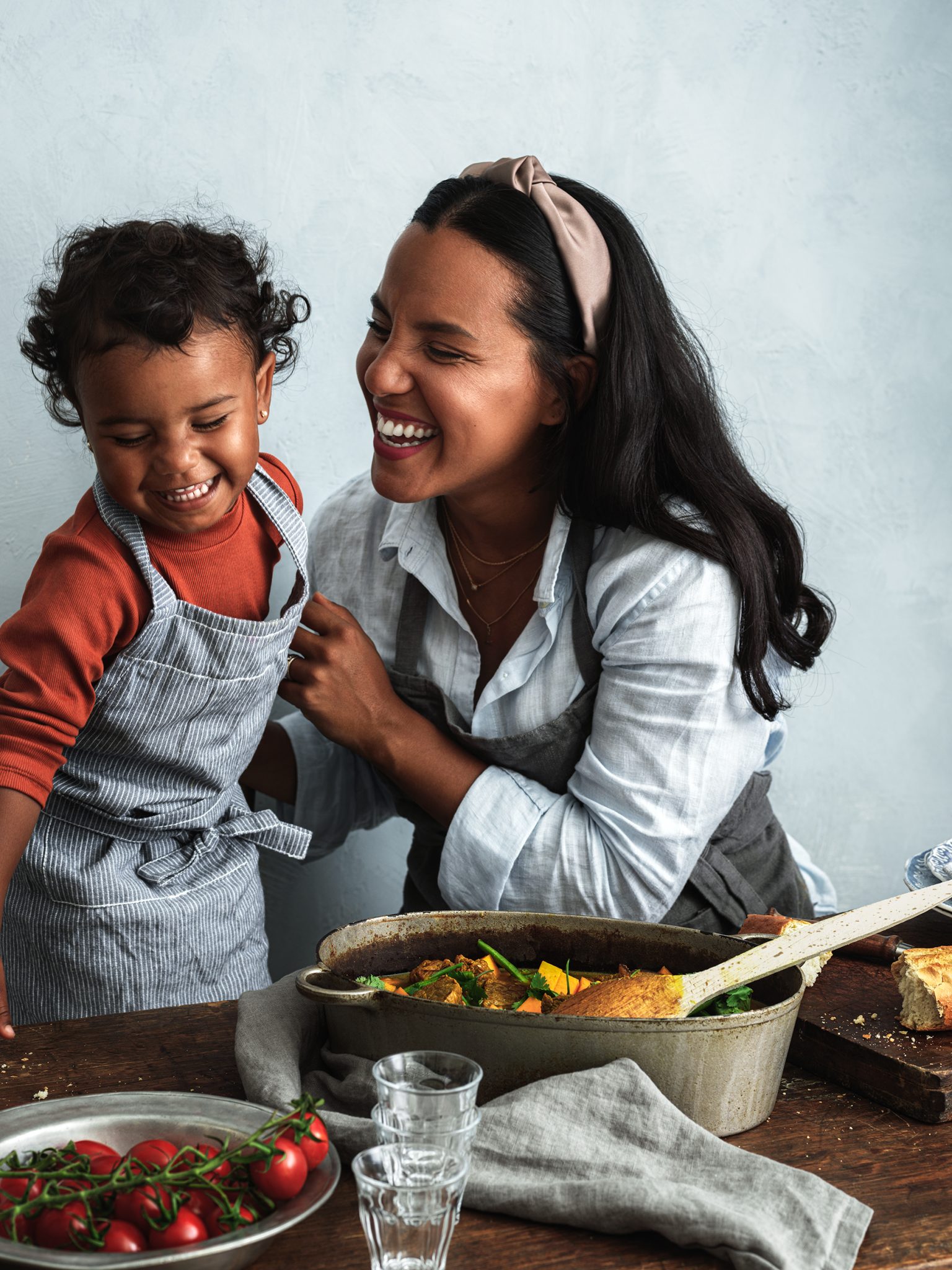 a woman and child smiling at each other