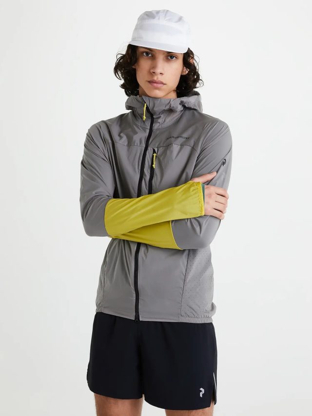 a person with arms crossed posing for the camera