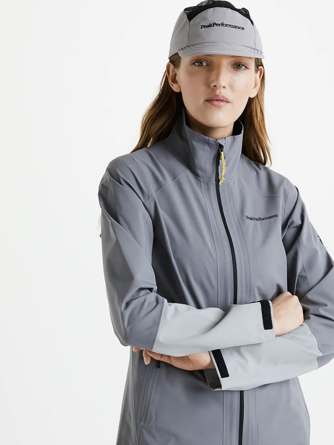 a woman wearing a white hat and jacket