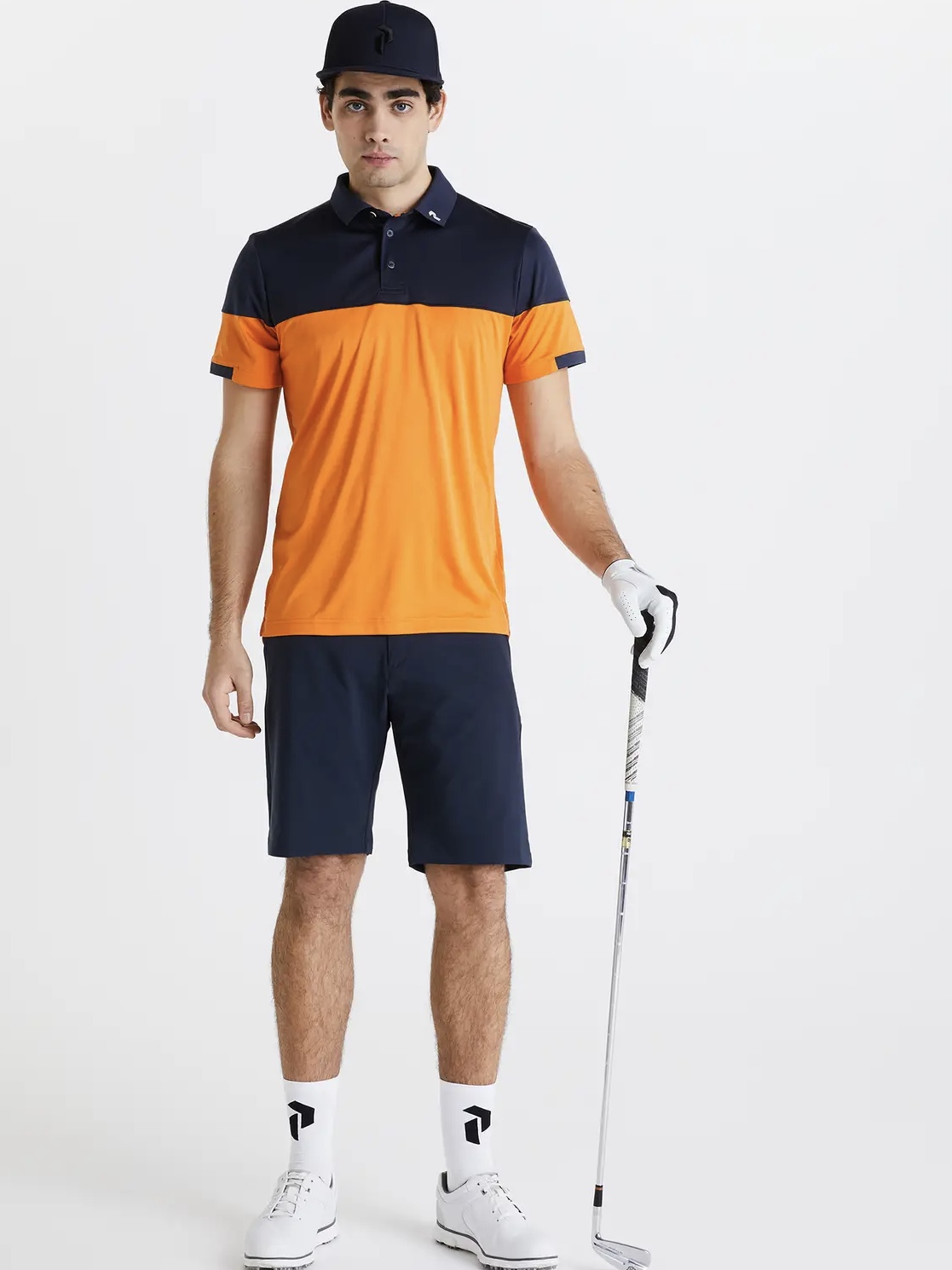 a man holding a golf club