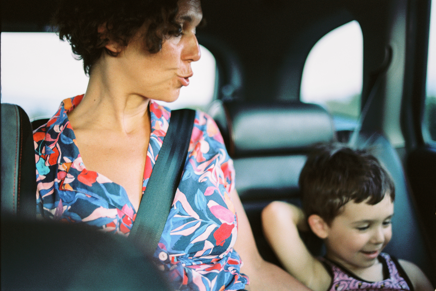 a woman and child in a car