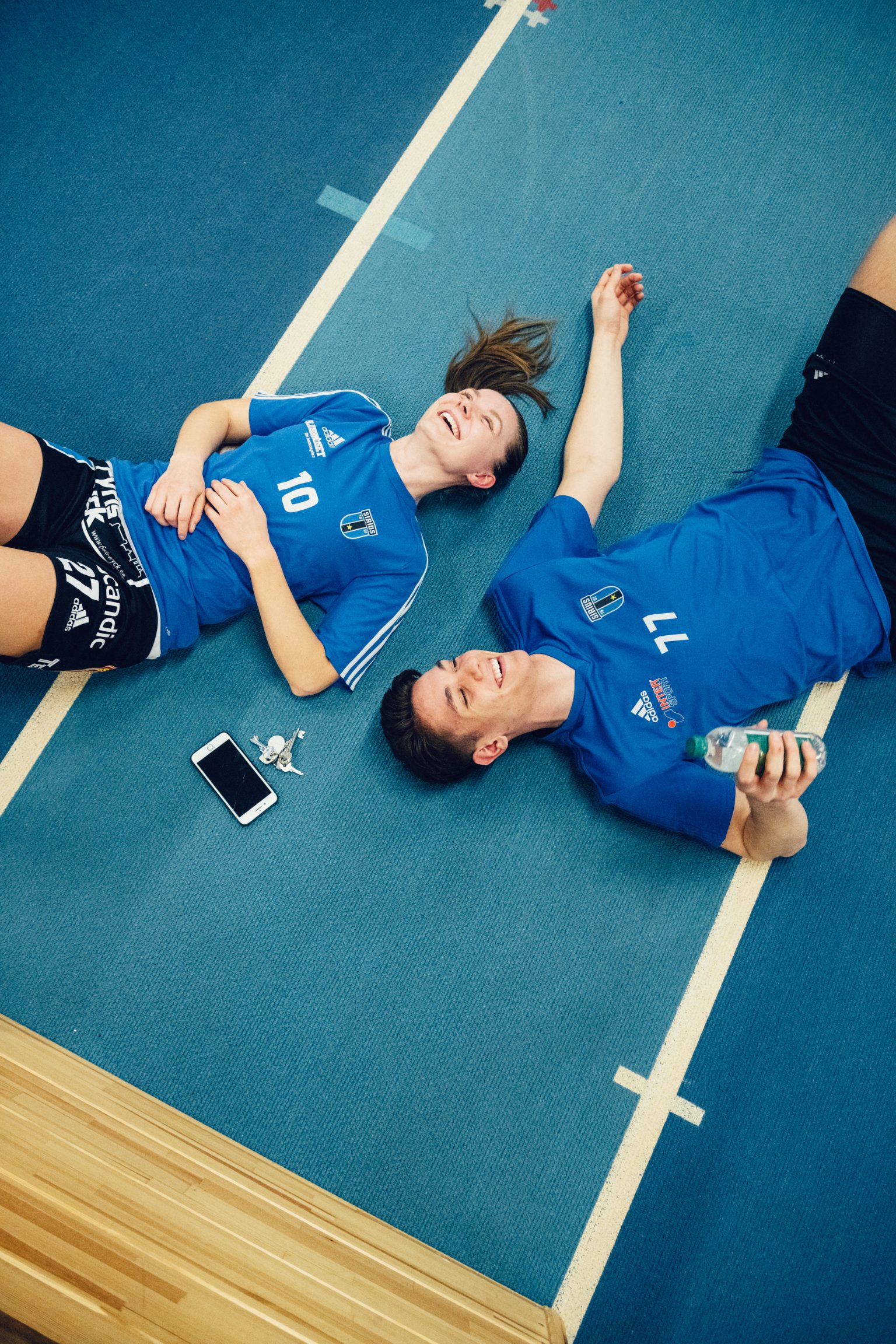 a man and woman lying on the ground