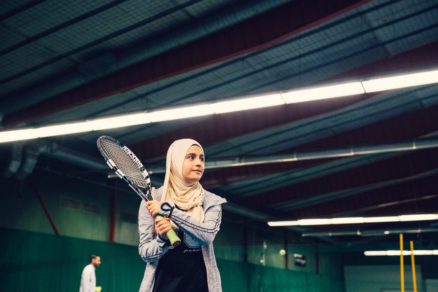 a woman holding a tennis racket
