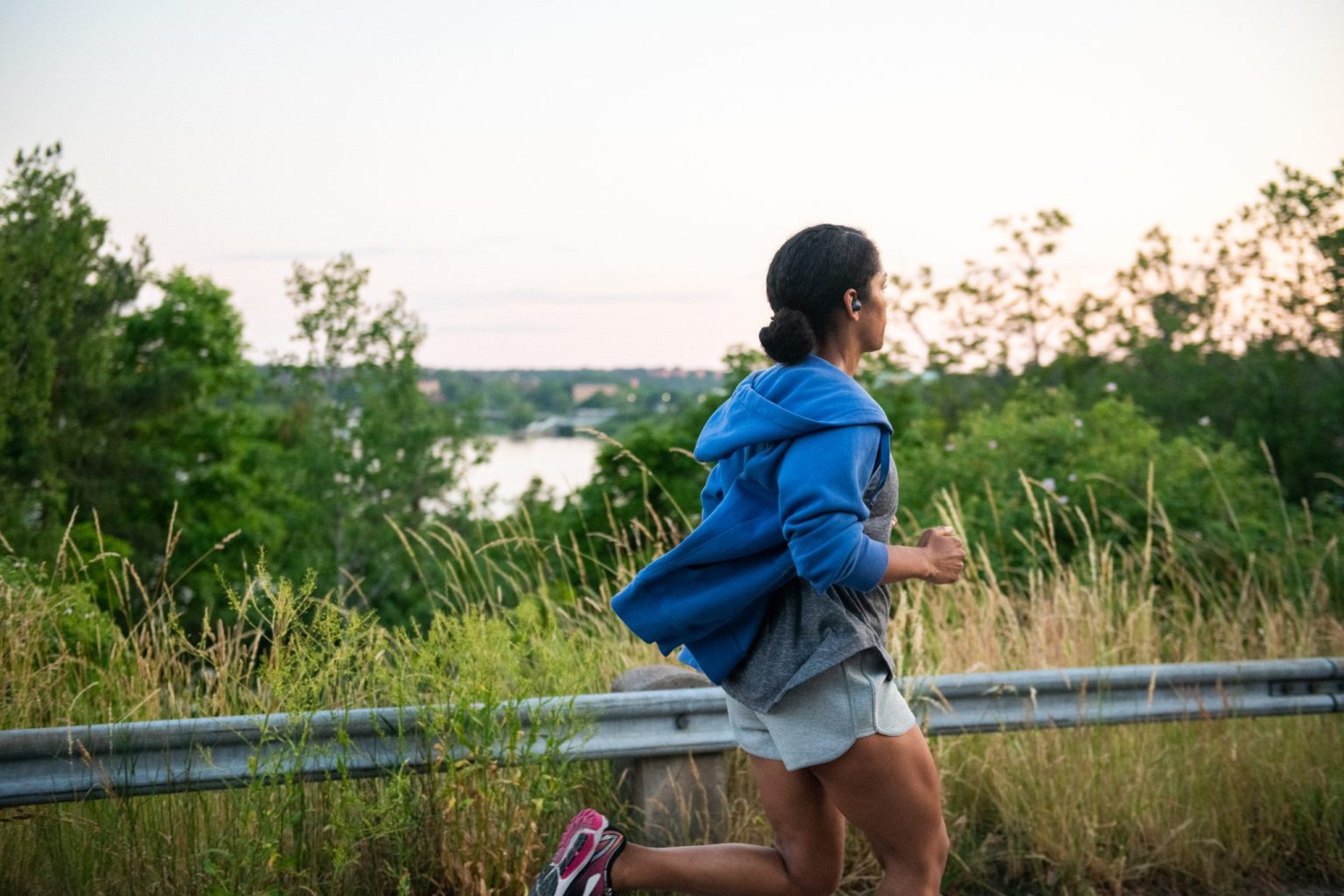 a woman running on a road