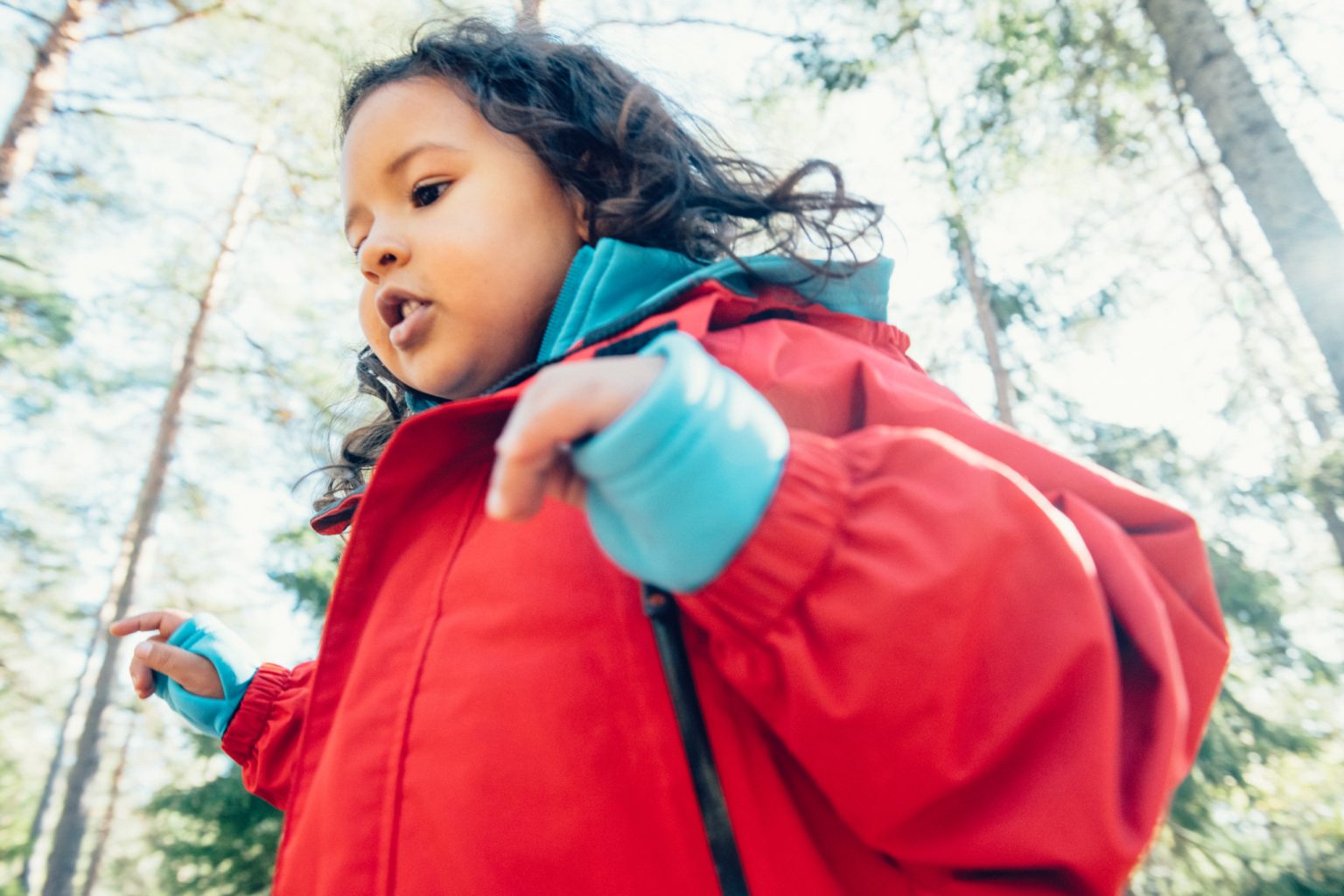 a child in a red coat