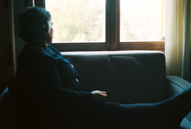 a woman sitting on a couch