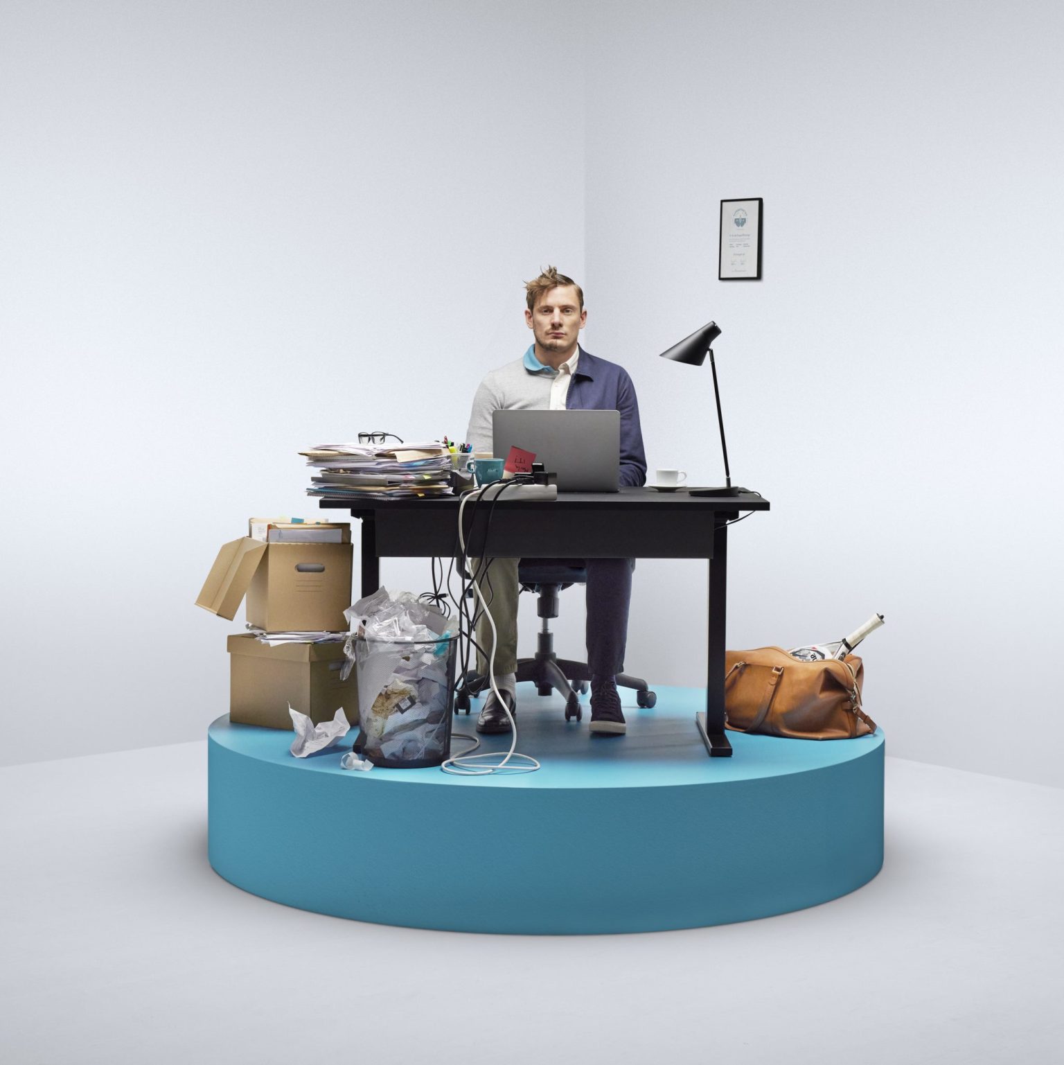 a man sitting at a desk with a computer