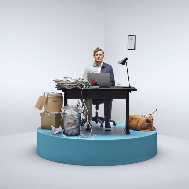 a man sitting at a desk with a computer