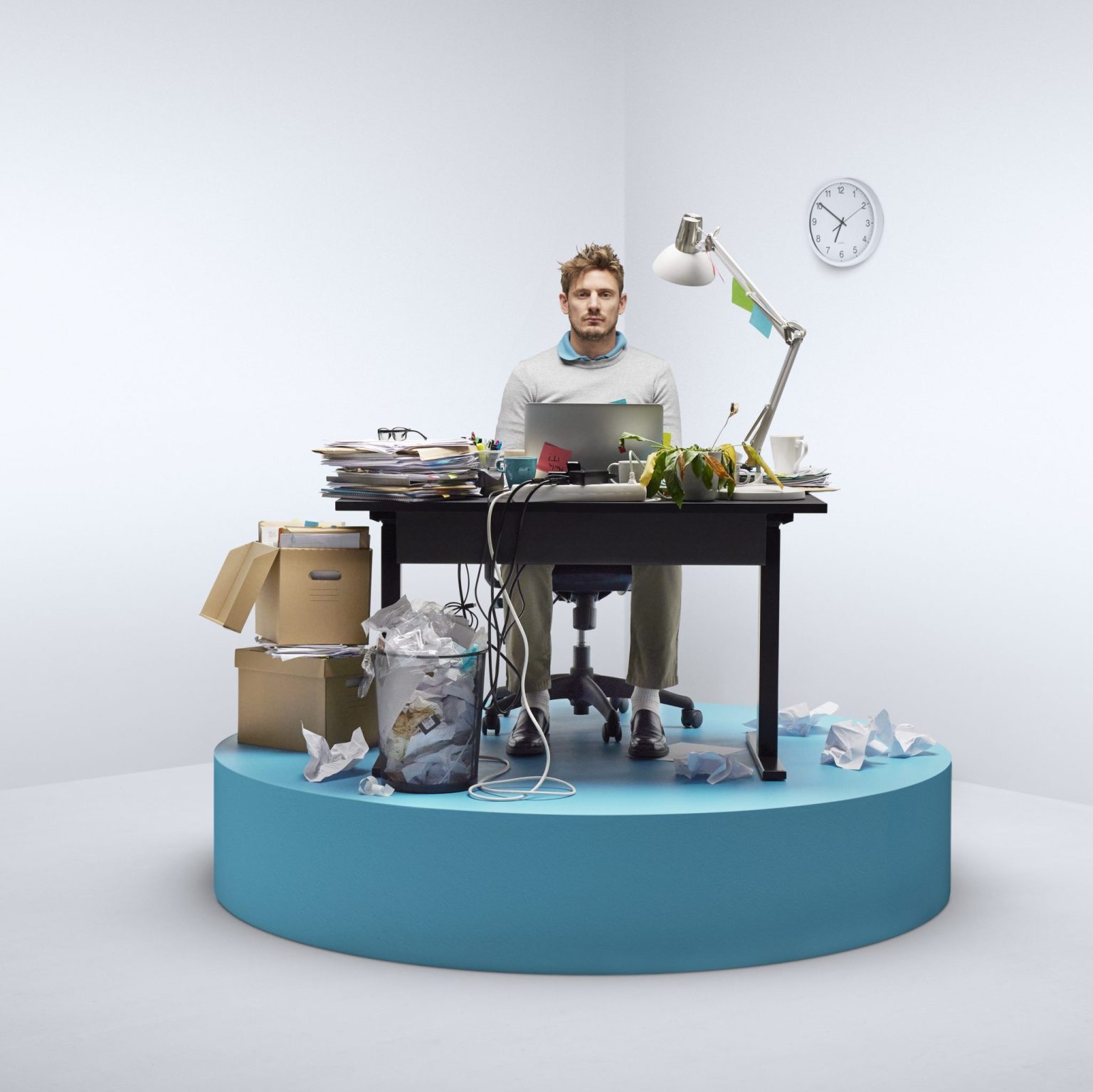 a man sitting at a desk with a computer