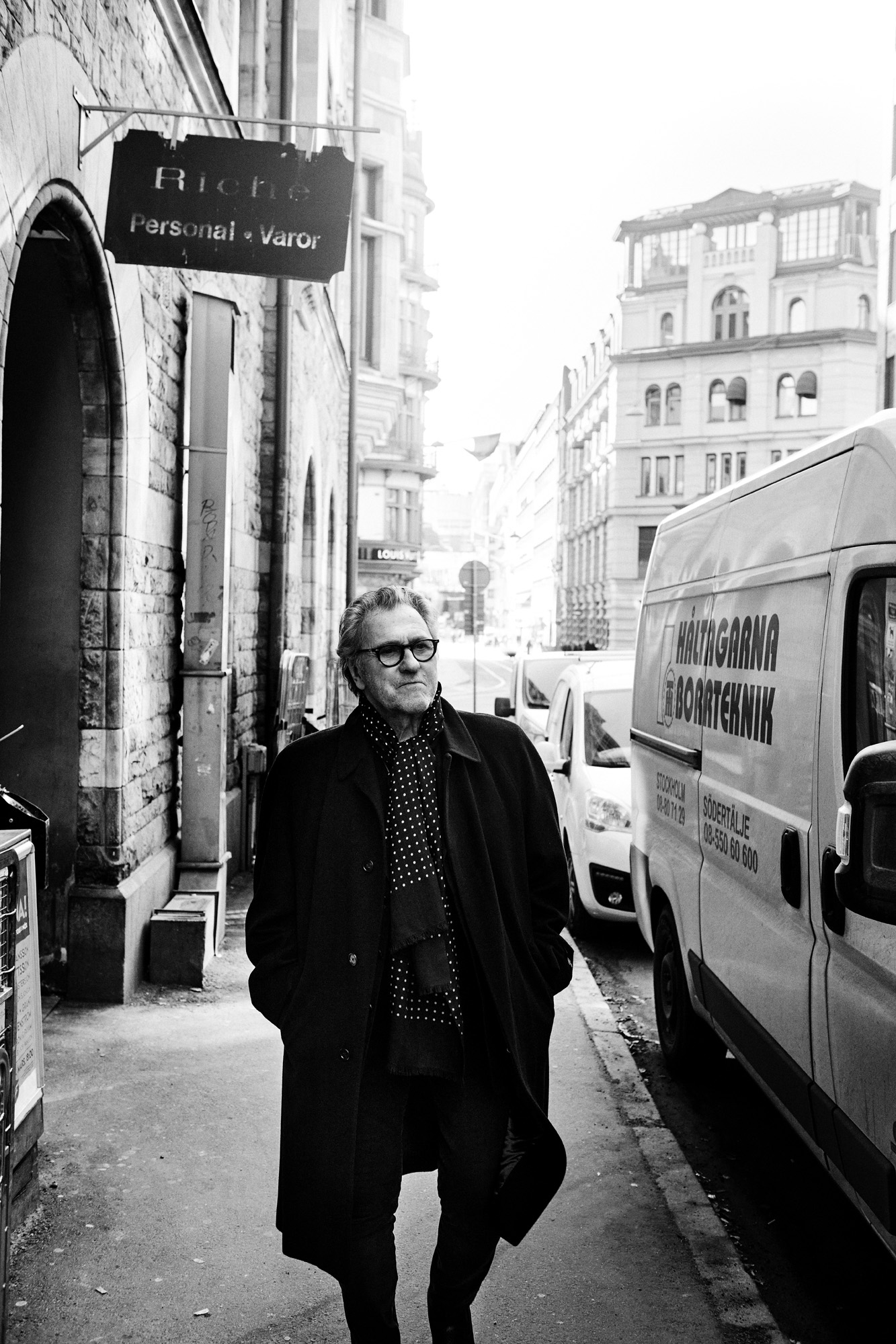 a man standing on the side of a street