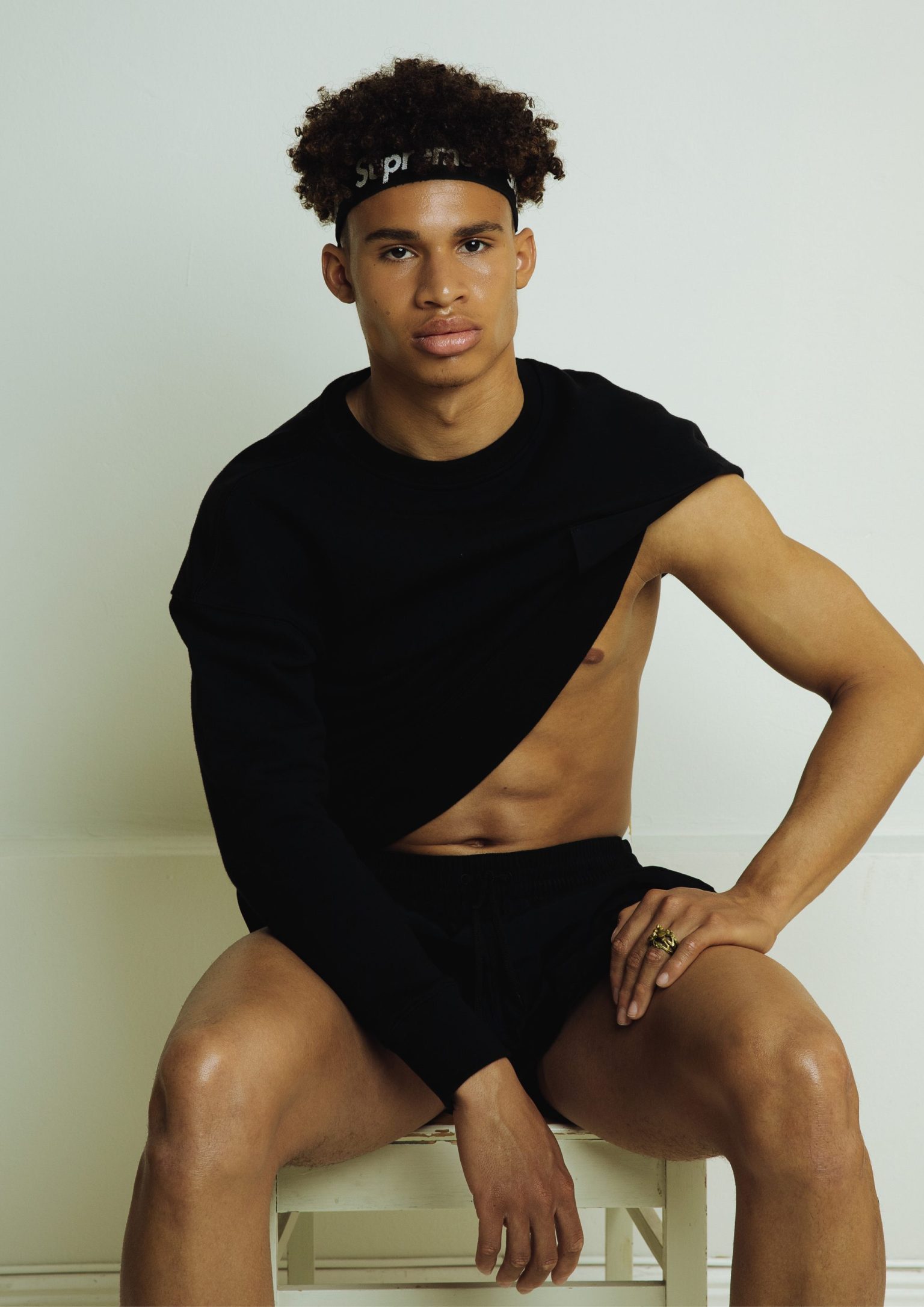 a man sitting on a stool