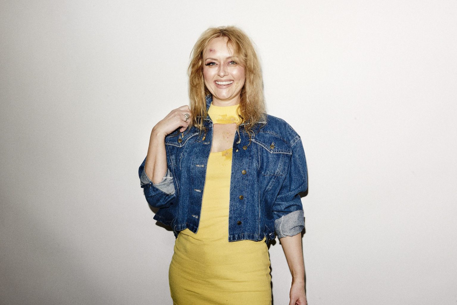 a woman in a yellow dress